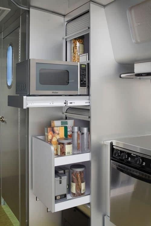 Small Kitchen Storage Ideas - Hideaway the microwave so that it can go into a cupboard sideways and doesn't take up precious counter space.