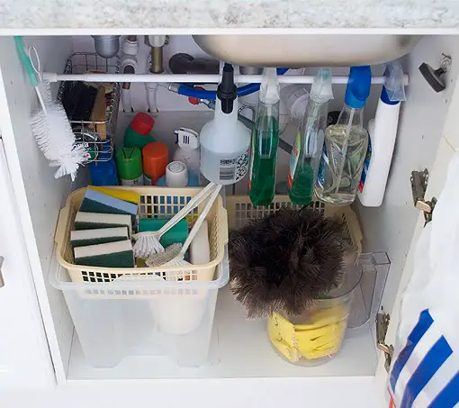 Small Kitchen Storage Ideas - Use tension rods to hang spray bottles - when you need to utilize all the space you can in your small RV kitchen.