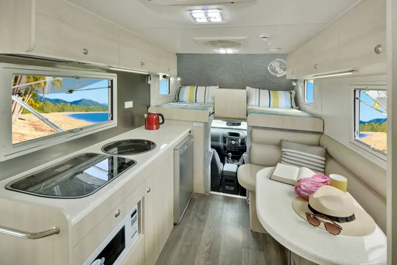 Best Compact Motorhome - The Explorer Motorhomes have a big enough space for the kitchen and a dinette for two.