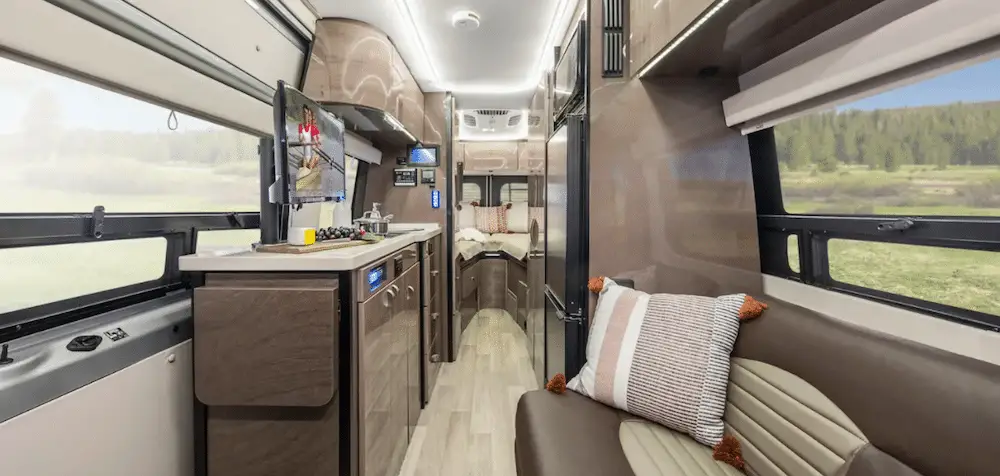 Interior of a modern Winnebago Era campervan looking towards the back doors