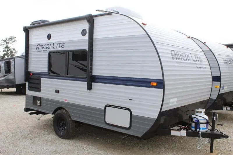 Exterior side view of a small super lite travel trailer.