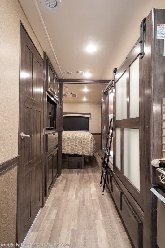 Interior of Fleetwood RV Flair 34J showing the bunk beds in the corridor