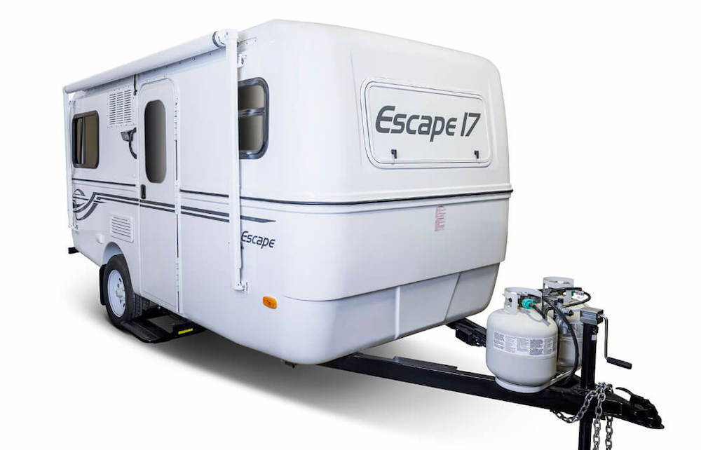 Exterior of white, small fiberglass travel trailer