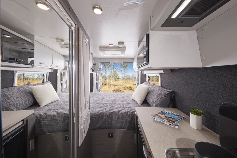 Interior of the Jayco JRV 19-1 campervan looking towards the bed in the back.