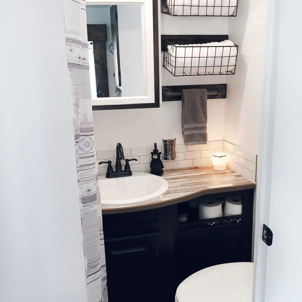 Simple black and grey decor in a small RV bathroom