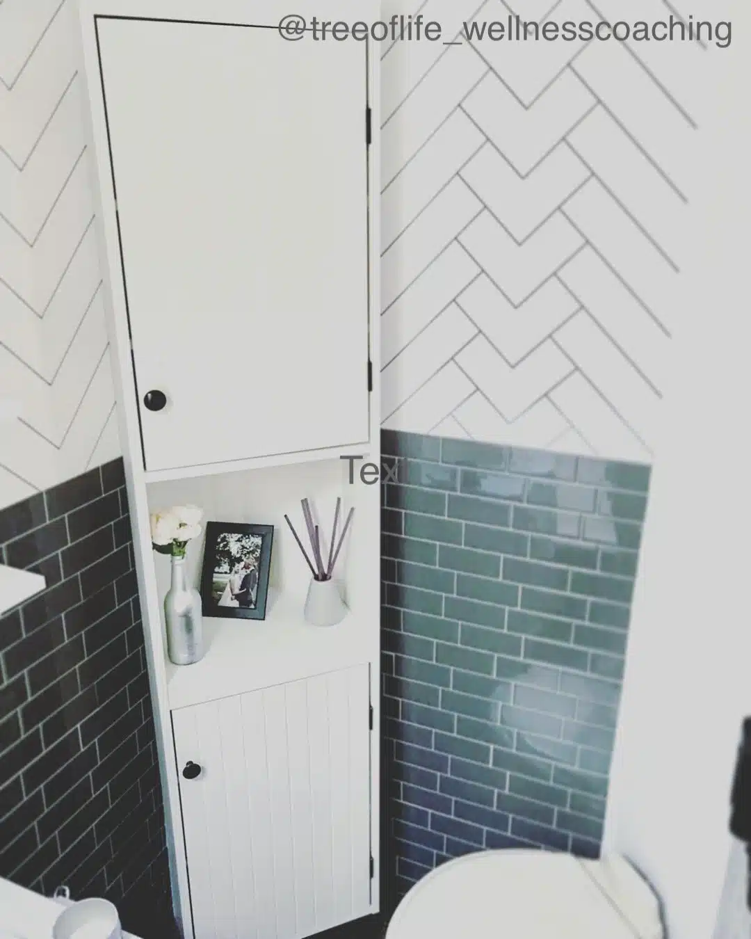 White corner cabinet in a very small RV bathroom.