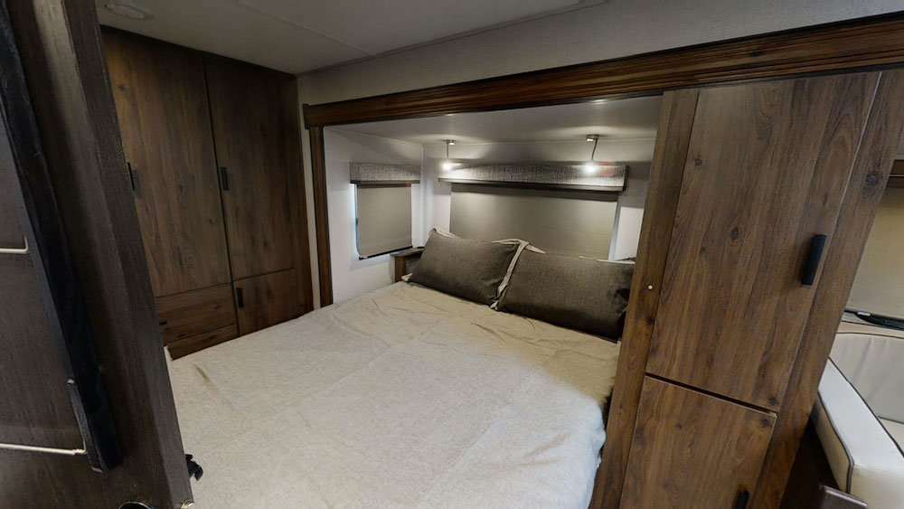 Interior of the Sunseeker MBS Class C motorhome showing the bed in the rear.