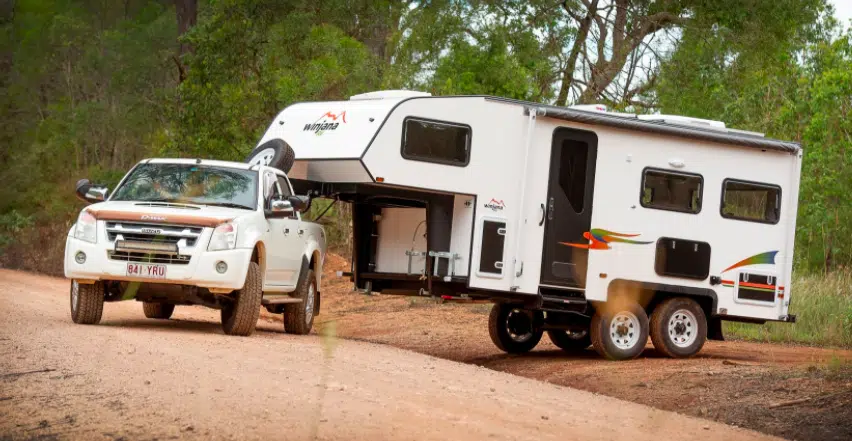 Winjana Ormiston 630 fifth wheel being towed off road over a ditch.