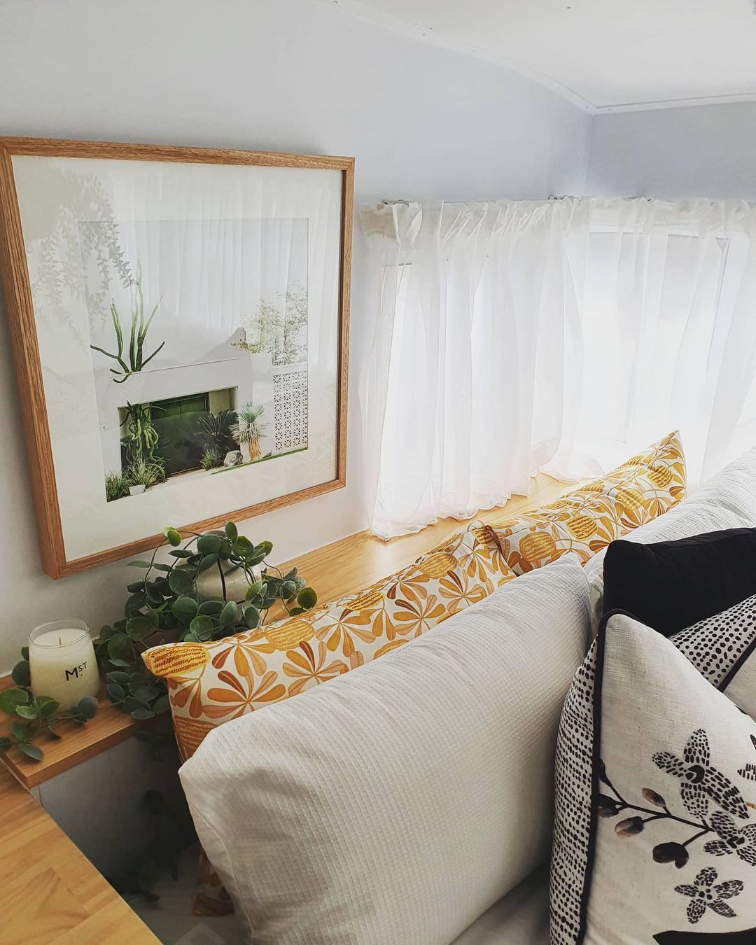 Bedroom decor in a renovated vintage camper.