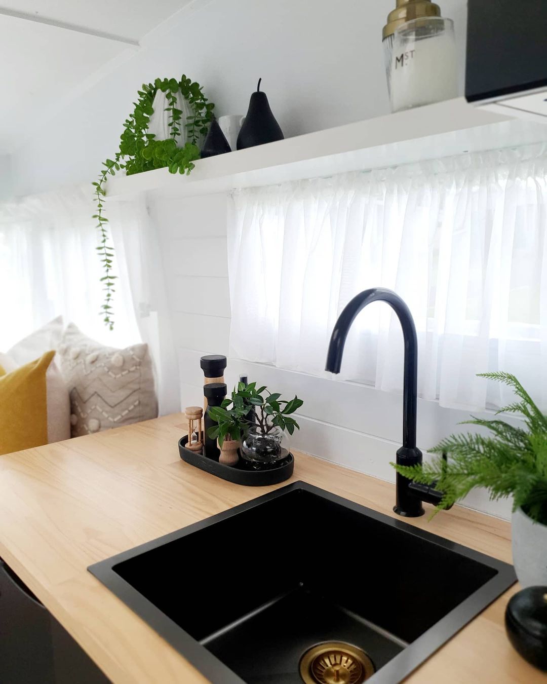 Kitchen area inside a remodeled camper.