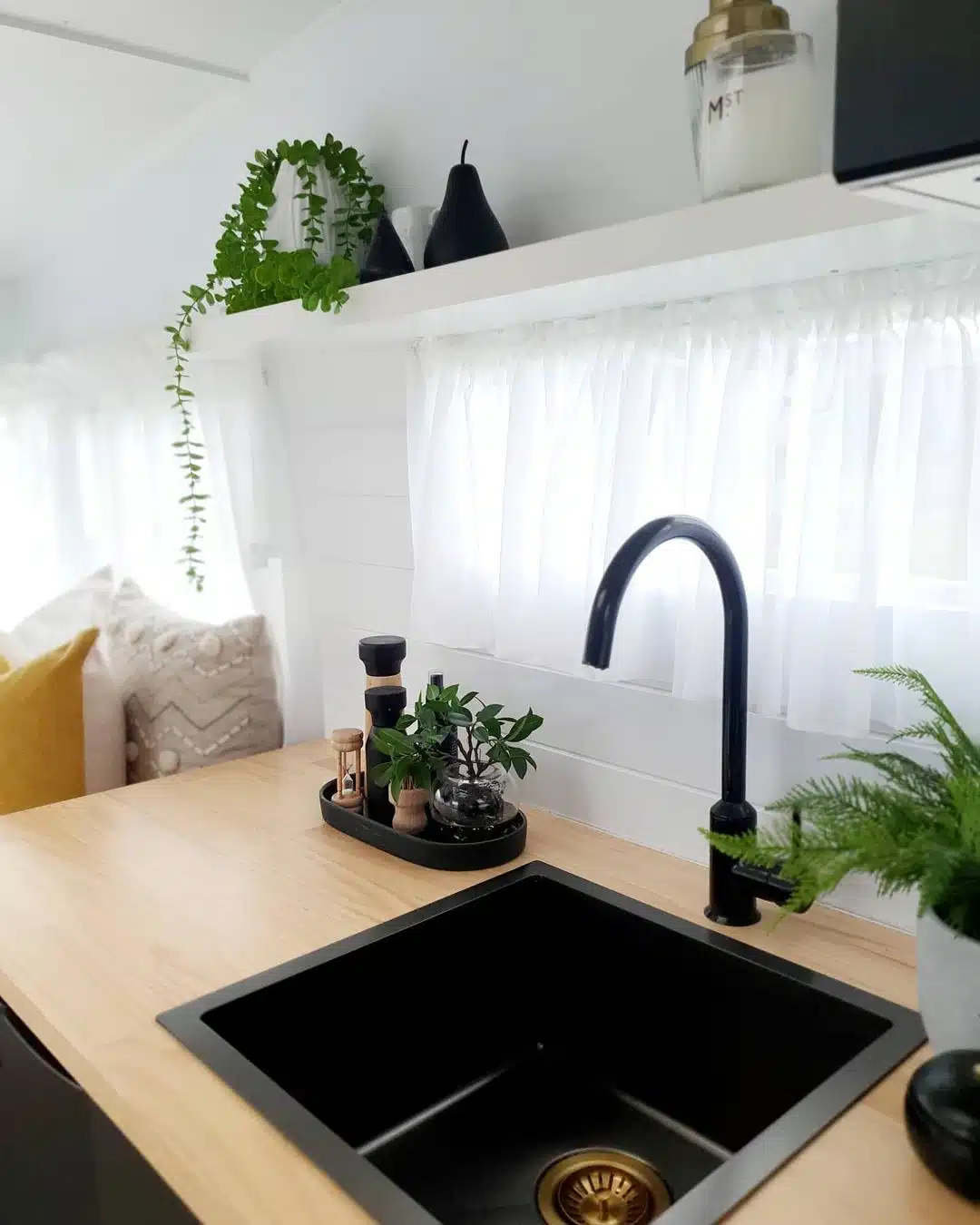 Kitchen area inside a remodeled camper.