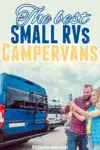 Couple taking a selfie in front of small RVs in a row.