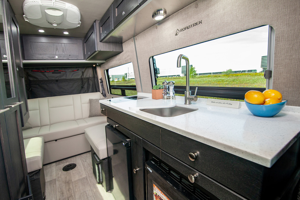 Interior of the SS Agile, a small RV / camper van looking towards the seating/bed area in the rear.
