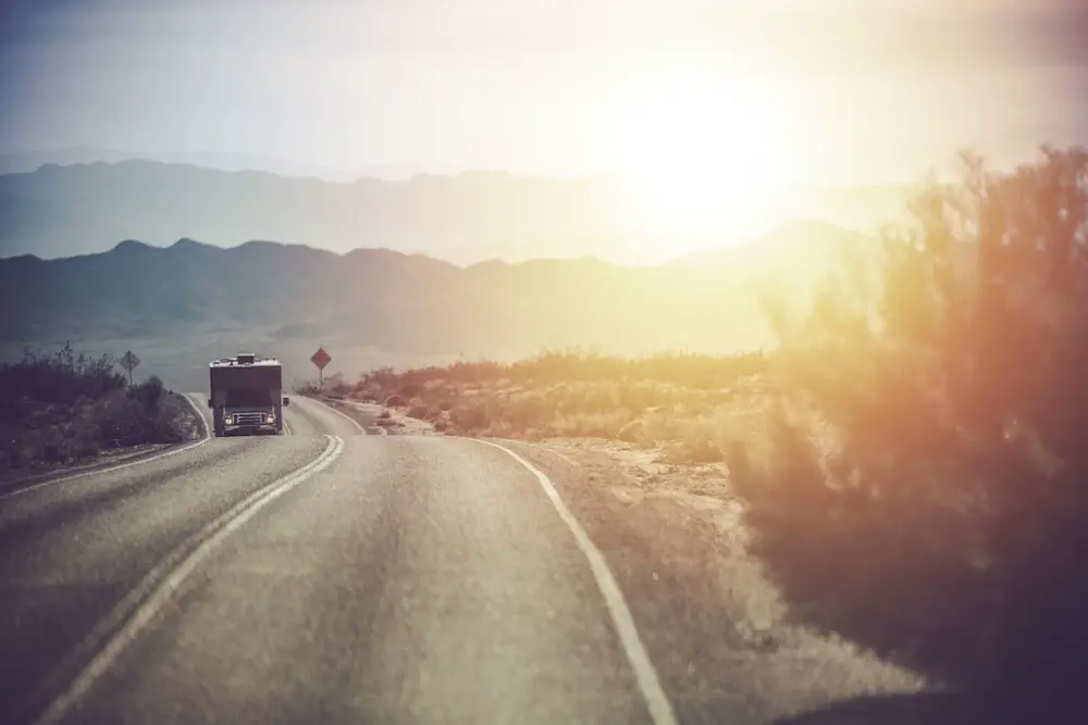 RV driving through the Mojave Desert in California.