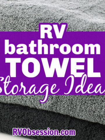 Stack of grey and black towels with text overlay that reads: RV bathroom towel storage ideas.