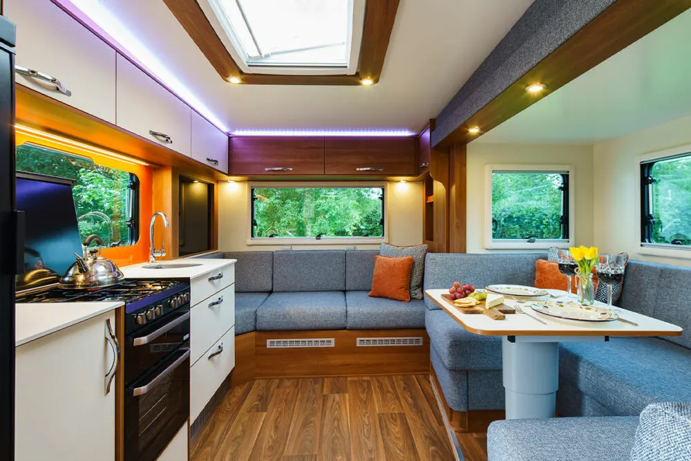 Interior view of the DreamSeeker fifth wheel camper by Fifth Wheel Co showing the kitchen and living areas.