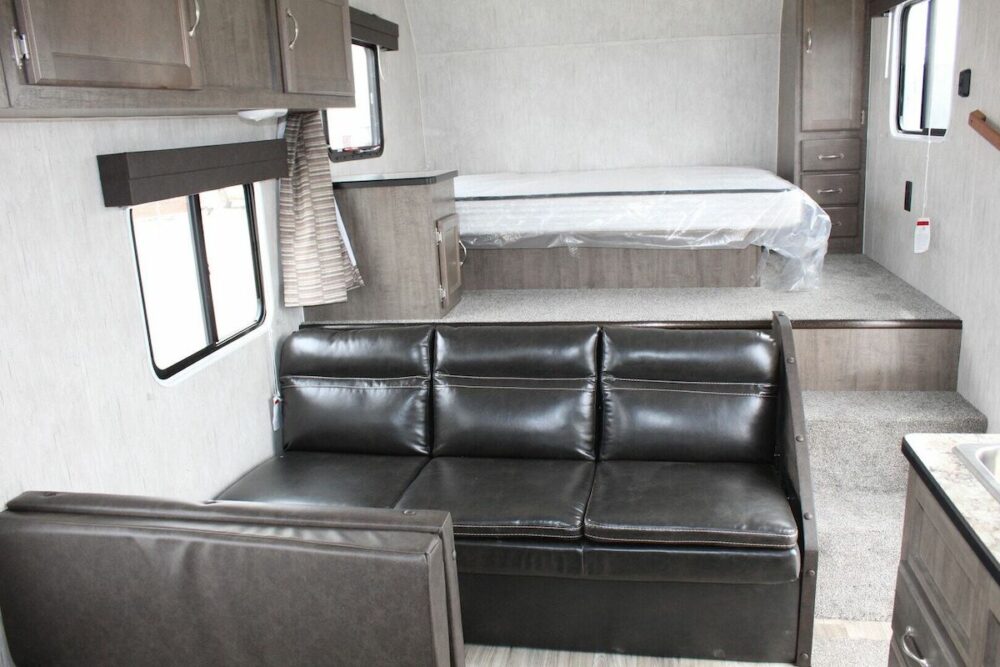Contemporary interior of an Idle-Time (Allen Camper Manufacturing) 199RB fifth wheel camper.