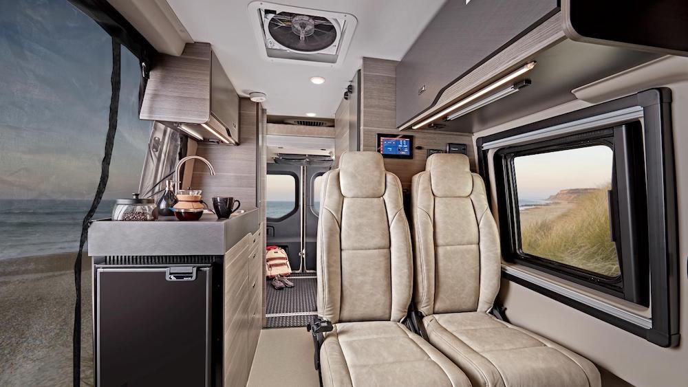 Interior of the Jayco Terrain Class B van showing the living area and the bedroom/garage area in the back.